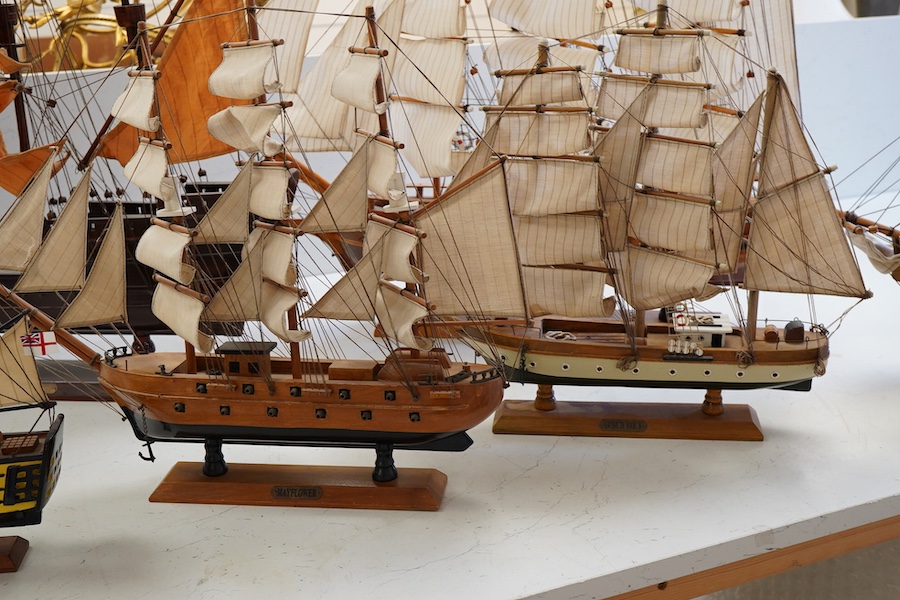 A collection of ten wooden models of famous ships including; the Cutty Sark, HMS Victory, the Mayflower, Revenge, and Santa Maria, largest 125cm wide